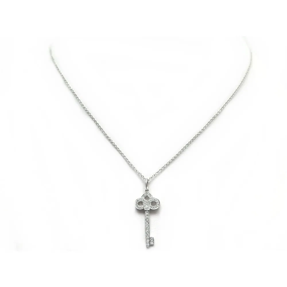 TIFFANY & CO COLLIERS pendentif cle fleur de lys diamant + chaine platine - 25485858